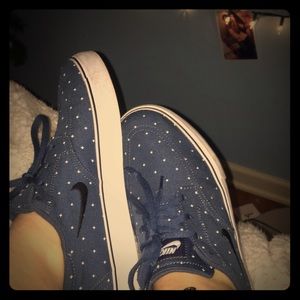 blue and white Nike janoskis